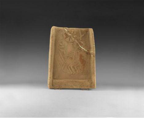3rd-4th century AD. A rectangular terracotta tile with raised border to three sides, with a later carved low-relief image of 