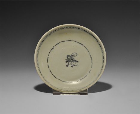 19th century AD. A blue-glazed ceramic dish with basal ring; concentric blue lines to the inner face with pellets and central