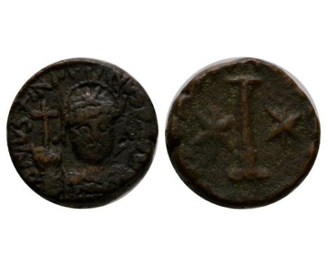 527-565 AD. Rome mint. Obv: DN IVSTINIANVS P AVG legend with helmetted and cuirassed bust facing holding globe with cross and