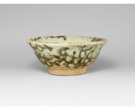 Ming Dynasty, 1368-1644 AD. A shallow ceramic bowl with green crackle-glaze finish.  95 grams, 10cm (4"). Property of an Esse