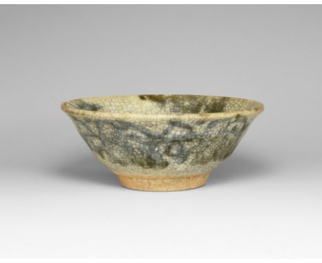 Ming Dynasty, 1368-1644 AD. A shallow ceramic bowl with blue crackle-glaze finish.  103 grams, 10cm (4"). Property of an Esse