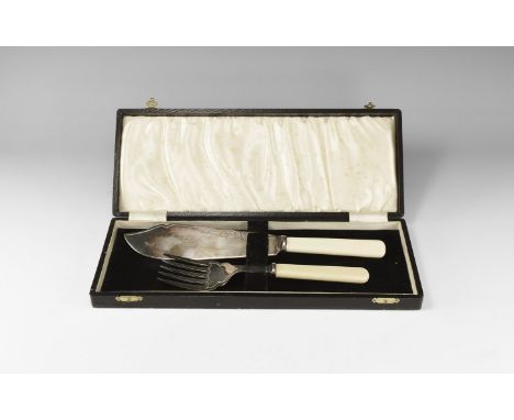 Early 20th century AD. A pair of bone-handled fish serving utensils in a velvet-lined leather-covered box, comprising: a knif