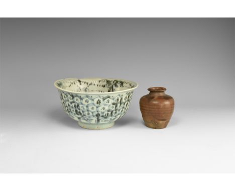 15th-20th century AD. A mixed group of ceramic items comprising: a bell-shaped provincial ware glazed bowl with black floral 