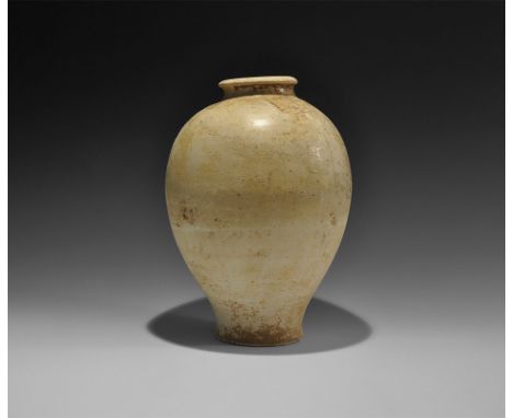 Tang Dynasty, 618-906 AD. A ceramic whiteware part-glazed piriform jar with short neck and chamfered rim.  2.3 kg, 30cm (11 3