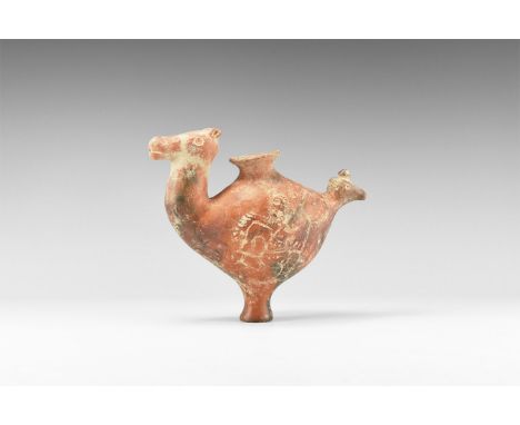 1st millennium BC. A hollow-formed ceramic jar with slender waisted foot, bulbous body with flared neck, addorsed camel and b