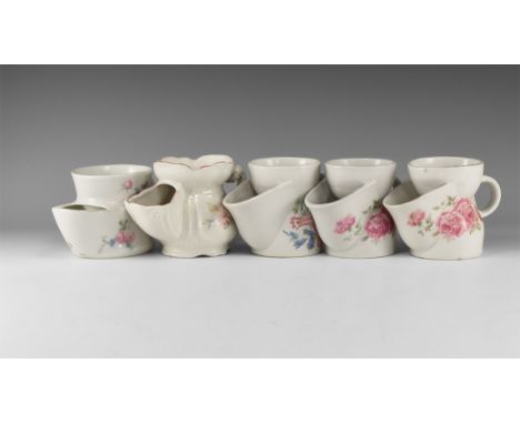 20th century AD. A mixed group of white-glazed ceramic shaving mugs comprising: two with pink rose transfer motifs, stamped '