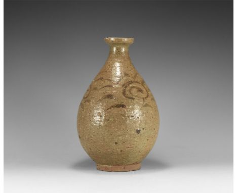 Yuan Dynasty, 1271-1368 AD. A glazed ceramic piriform vase with basal ring and inturned rim, painted tendrils and flowers to 