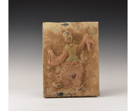 20th century AD. A rectangular ceramic plaque with high-relief image of a dancing girl in animated pose, with keying to the r