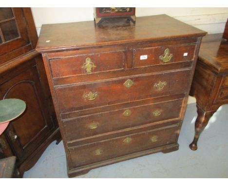 Small 18th Century oak straight front chest of two short and three long drawers with brass handles and escutcheons on low bra