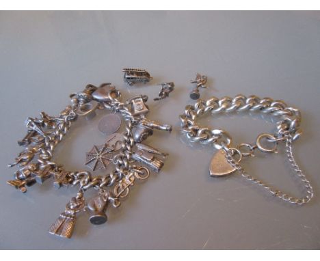 Silver charm bracelet with twenty five plus silver charms including fire engine, animals, spinning wheel, figures etc., toget