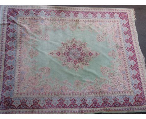 Large mid 20th Century Indian carpet with a medallion and floral design on a pale green ground with borders, 4.8m x 3.8m