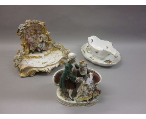 Continental porcelain group together with a Herend sauce dish with integral stand and a 20th Century Continental porcelain gr