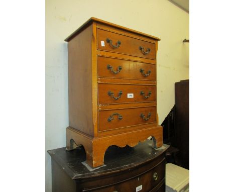 Small reproduction yew wood four drawer bedside chest, two similar occasional tables and a console table