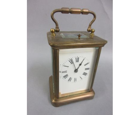 Late 19th or early 20th Century brass cased carriage clock, the enamel dial with Roman numerals, the two train movement with 
