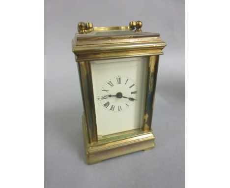 Miniature brass cased carriage clock with enamel dial, Roman numerals and single train movement, 3ins high excluding handle