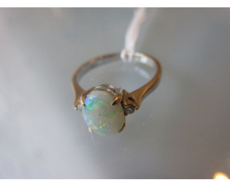 18ct White gold opal ring with diamond set shoulders CONDITION REPORT Ring size KOpal is about 8mm x 6mm