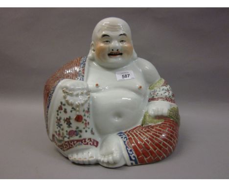 Early 20th Century Chinese porcelain enamel decorated figure of a seated Buddha, bearing poorly struck character mark to base