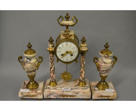 French flecked marble and ormolu clock garniture, the enamel dial with Arabic numerals, with a two train movement striking on