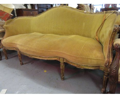 19th Century French giltwood salon sofa with a shaped back and seat, overstuffed upholstery and turned fluted front supports,