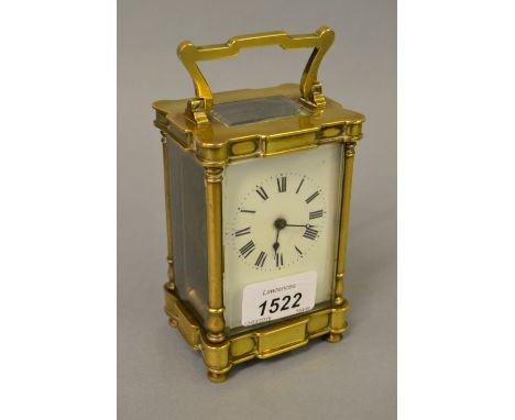Early 20th Century brass cased carriage clock, the enamel dial with Roman numerals and keywind movement (with key), 3ins wide
