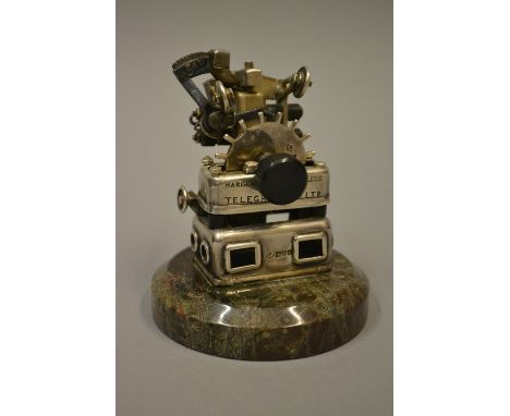 Unusual silver and base metal novelty table lighter mounted on polished stone plinth, inscribed Marconi, Wireless Telegraph C