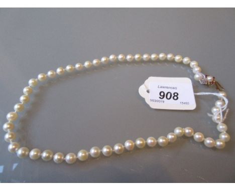 Uniform cultured pearl necklace with a 9ct gold ruby set clasp