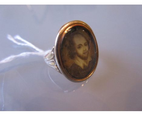 18th Century gold ring inset with an oval head and shoulder portrait of a gentleman CONDITION REPORT Splits to the ring head 