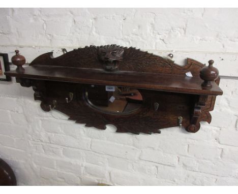Carved oak mirror inset coat rack
