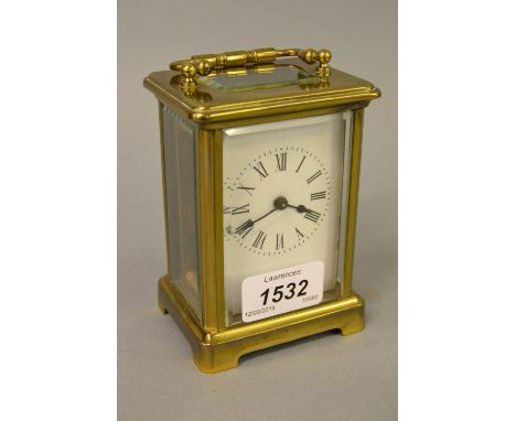 Brass cased carriage clock with enamel dial, Roman numerals and single train movement