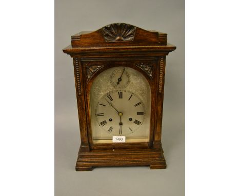 Early 20th Century oak cased bracket clock, the silvered dial with Roman numerals and chime / silent selector to the arch, th