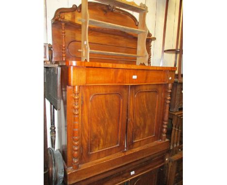 Small Victorian mahogany serpentine fronted chiffonier with a shelf back and two panelled doors, 41ins wide