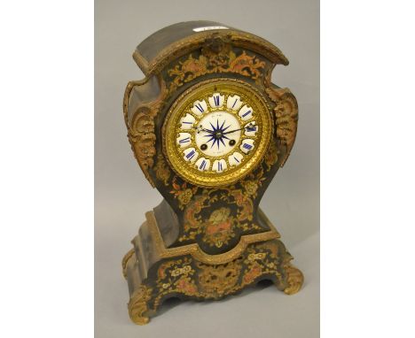 19th Century French ebonised ormolu mounted and buhl inlaid mantel clock, the waisted case inlaid with cut brass, mother of p