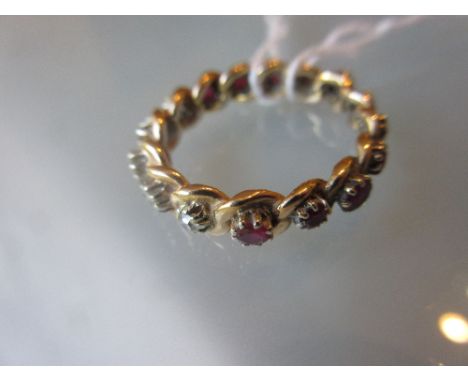 Yellow metal full eternity ring set diamonds and rubies CONDITION REPORT Size R. Good condition. Made possibly in last 20 yea