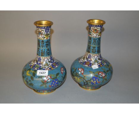 Pair of Chinese cloisonne bottle vases decorated with bands of stylised flowers, Chinese characters and key pattern on a blue