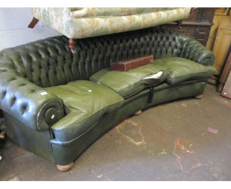 Large 20th Century green buttoned leather upholstered Chesterfield type sofa of curved design (at fault)