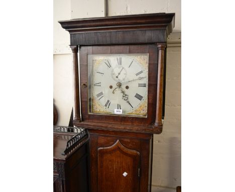 George III oak longcase clock, the square hood above an arched panelled door and plinth base, the painted enamel dial with Ro