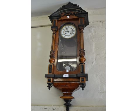 Victorian walnut and ebonised Vienna wall clock, the enamel dial with Roman numerals with a two train striking movement