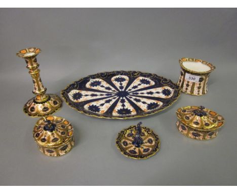 Royal Crown Derby Imari pattern dressing table set comprising: an oval dish, candlestick, pair of trinket boxes, ring tree an