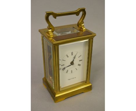 Gilt brass carriage clock, the enamel dial with Roman numerals inscribed Mappin and Webb Ltd with an English seven jewel move