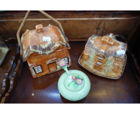 A COTTAGE WARE BISCUIT BARREL, a similar cheese dish and a Carltonware jam pot with spoon (3)
