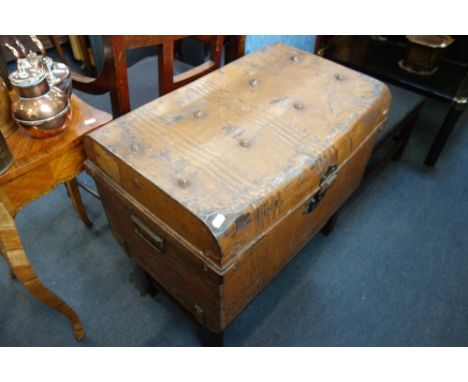 A VINTAGE TIN TRUNK containing wooden brushes, two marble dishes and sundries