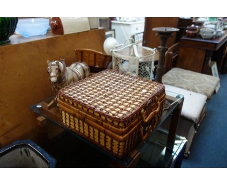 A CAST IRON CANDLESTICK, a picnic hamper and sundries