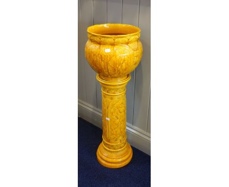 A BURMANTOFT'S FAIENCE ORANGE GLAZED JARDINIERE ON STAND, 85cm high (overall)