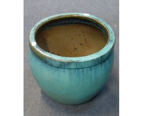 A GREEN GLAZED GARDEN PLANTER, 30cm high