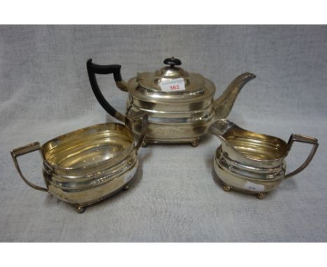 A SILVER THREE PIECE TEA SET, by William Hutton &amp; Sons, Sheffield, 1933, comprising milk jug, sugar bowl and teapot, the 