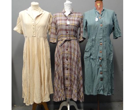 Three vintage 1940's/50's dresses; one slubbed silk with faux pearl buttons and two woollen; one check pattern with 'Nuwear' 