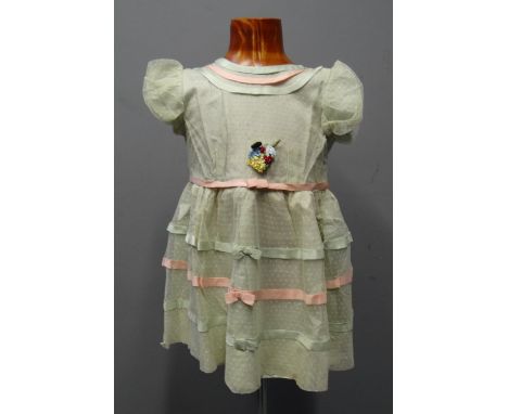 Two similar vintage early 20th Century children's tulle and ribbon embroidered dresses; one with appliqued faux flowers. (2)(