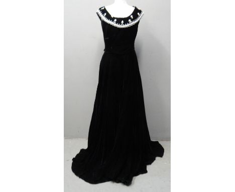 Full length 1950's black velvet dress by Perlmutt Model, with beaded and faux pearl embellished collar. (B.P. 21% + VAT)