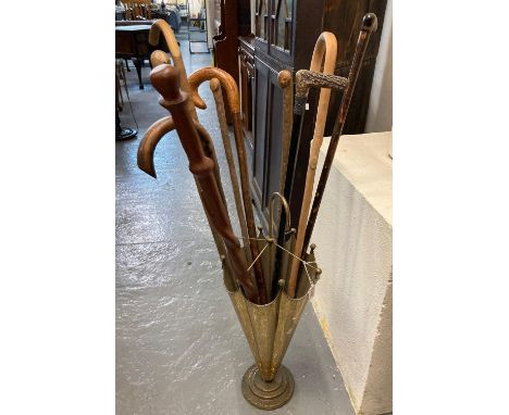 Novelty brass umbrella/stick stand in the form of an umbrella together with assorted walking sticks.   (B.P. 21% + VAT) 