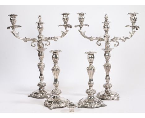 A post-Regency Old Sheffield Plate four-piece table lighting suite, comprising of a pair of three-light candelabra and a pair